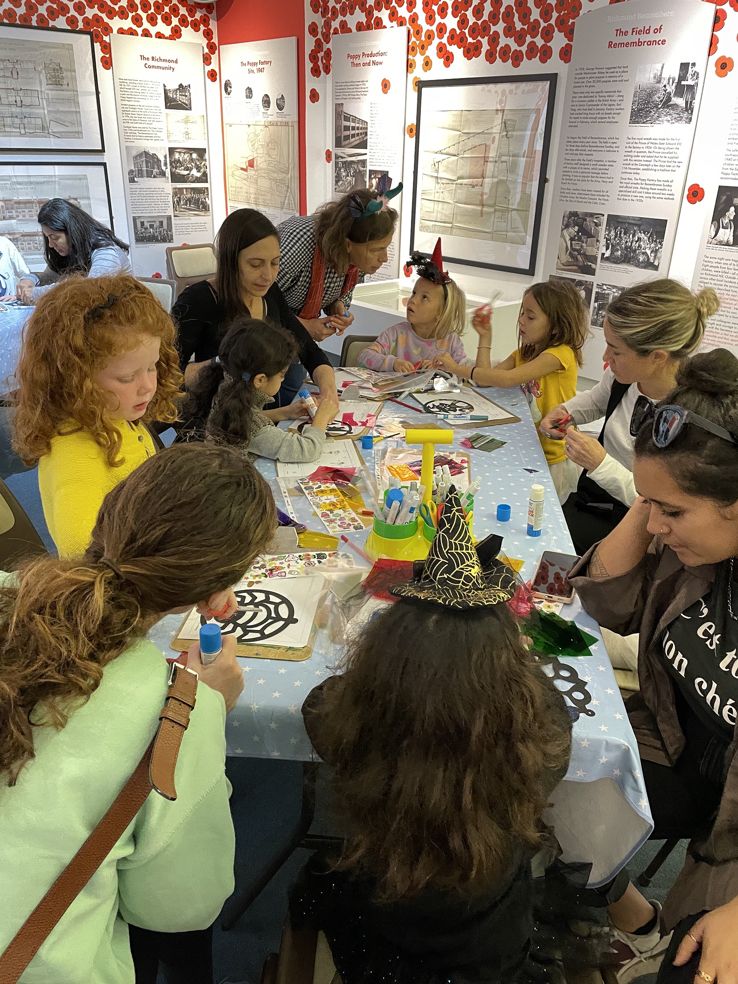 Families doing a craft activity at a workshop